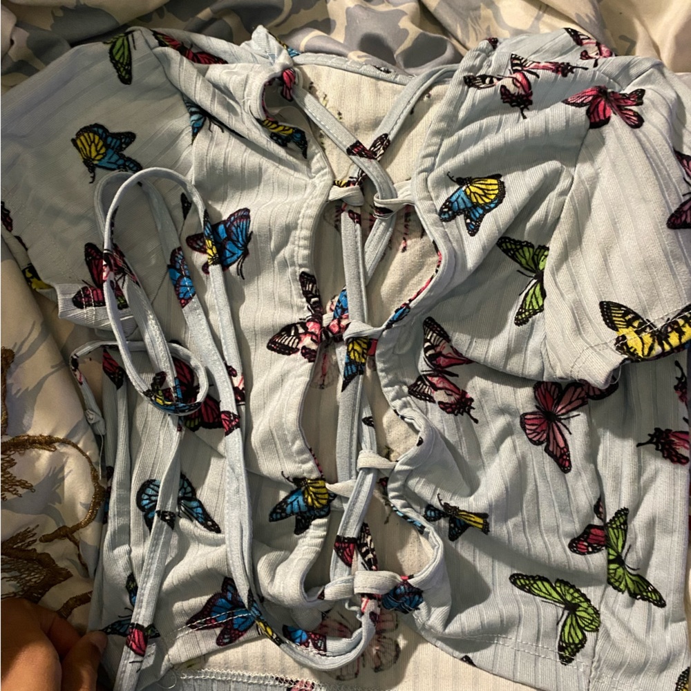 Small blue butterfly crop top with crossing in the back
